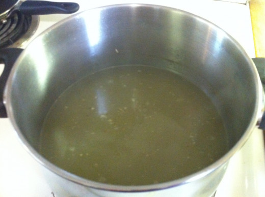 Strained chicken broth from the pot.