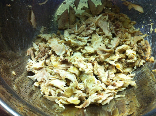 Remove as much chicken meat from the carcasses as possible.