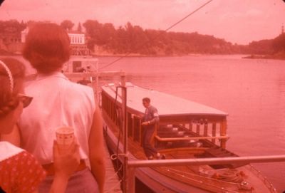 Nancy (red dress, lower left) boarding boat to tour Wisconsin Dells