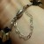 When the clasp is not stuck together, the bracelet with the added length of chain slips easily over the hand. Pull the clasp together and presto!