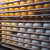 Cheese wheels at varying levels of readiness. Each wheel gets 4 coats of a plastic blend material that protects it. Dark yellow wheels have 4 coats. Cheese wheels at varying levels of readiness. Each wheel gets 4 coats of a plastic blend material that protects it. Dark yellow wheels have 4 coats.