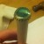 Place the bent cap on the end of a hardwood dowel. Place the bent cap on the end of a hardwood dowel.