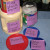 The structural components of the tower consist of 1 empty coffee creamer container, 1 empty Jiffy Peanut butter container (crunchy), and one oatmeal container with lids.