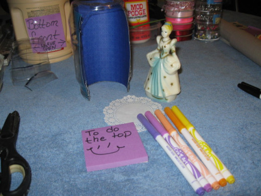 It's time to bling it up some. Grab a doily and some markers.