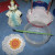Use temporary tattoos to decorate doilies for flooring on the balconies. Just cut it out. Remove the covering. Place it face down on the doily. Wet it really good. Hold and rub, rub, rub. Peel off the backing.