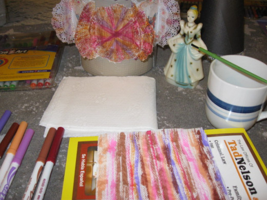 I colored the napkins by picking my colors and drawing simple lines in a pattern all the way down each napkin. Then, I painted over it lightly with coffee to give it a mottled look.