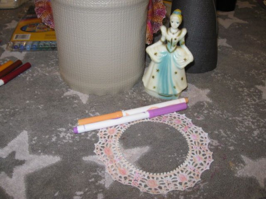 Cut off and color up some "lace" from your doilies and glue down at the stack joints to cover seam lines.