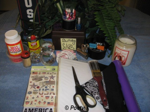 Get everything together. This is everything I set out to work with. I found out the candle doesn't work. I traded it for an oil warmer to melt the wax in a tray and then used a simple kid's paintbrush.Supplies - 1 old three ring binder, 2 bandannas, 