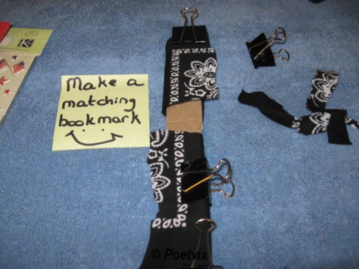 Use the scraps from when you cut for the three ring binder post. Arrange, wrap, clip and glue just like before.