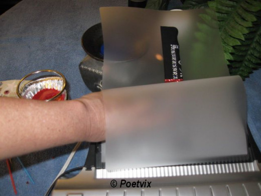 Always insert the laminating pouch sealed end first. Be sure to leave some free border space at the top.