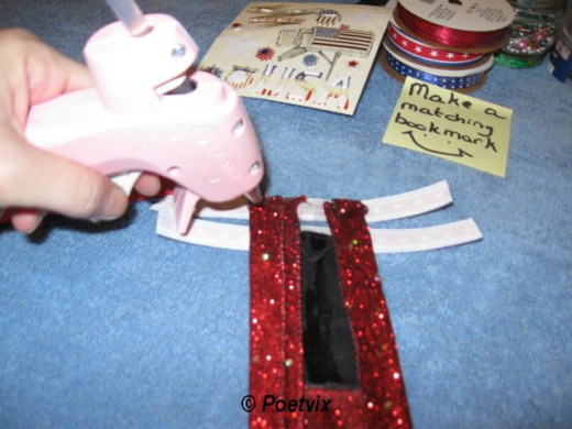 Fold down your side border ribbon on the back and glue. Wrap the trim ribbons from the front and glue on the back being careful to line up the ribbons well.