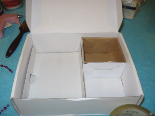 The smaller box and a cardboard folded insert will make the compartmental dividers within our charging station. The smaller box and a cardboard folded insert will make the compartmental dividers within our charging station.