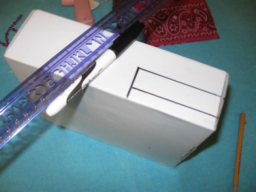 Draw and cut out an opening in the back for electrical cords to go through. Draw and cut out an opening in the back for electrical cords to go through.