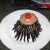 I frosted a cupcake. Made a ring of cut Twizzlers around it. Applied a frosted cookie and 2 gummy candies over that. I frosted a cupcake. Made a ring of cut Twizzlers around it. Applied a frosted cookie and 2 gummy candies over that.