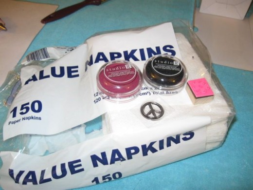Use stamps and ink to decorate the napkins. I used about 12 all told. Use stamps and ink to decorate the napkins. I used about 12 all told.
