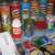 Materials: 1 regular can, 5 Pringles potato chip cans, Mod Podge, paper napkins, markers, ribbon, pony beads, brads, tape and five large beads. Materials: 1 regular can, 5 Pringles potato chip cans, Mod Podge, paper napkins, markers, ribbon, pony beads, brads, tape and five large beads.