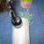 I found a cork screw was easier than the hole punch. The center can will spin inside the regular can with the other cans attached. I found a cork screw was easier than the hole punch. The center can will spin inside the regular can with the other cans attached.