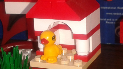 Lego Bird in a birdhouse.