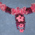 Add the sticker to the bottom of the tab still showing on the pendant. Glue down beads. Affix the last sticker on the bottom directly to the beads with hot glue. Add the sticker to the bottom of the tab still showing on the pendant. Glue down beads. Affix the last sticker on the bottom directly to the beads with hot glue.