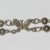 Close up of decorative butterfly charm on cardigan guard. Close up of decorative butterfly charm on cardigan guard.