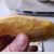 after removing mango fruit, run knife along edge of mango pit. You will need to pry the two sides apart.