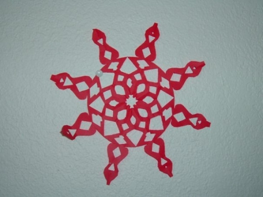 Red sunburst paper snowflake