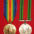 WWI Victory Medal and WWII Defence Medal pair - obverse WWI Victory Medal and WWII Defence Medal pair - obverse