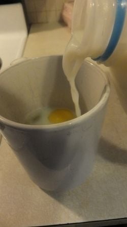Adding milk to scrambled eggs