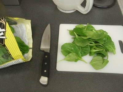 Preparing the spinach to make the sauteed spinach recipe