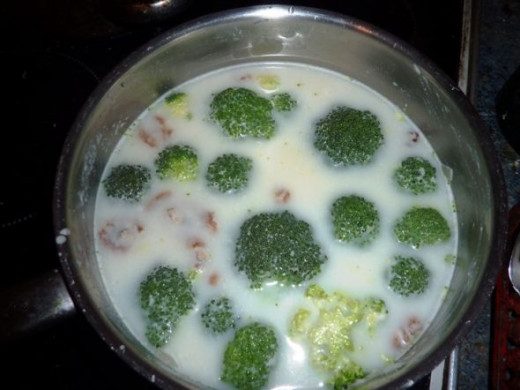 Adding broccoli florets to the broccoli and walnut soup