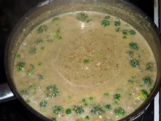Adding peas and smaller florets to the broccoli and walnut soup