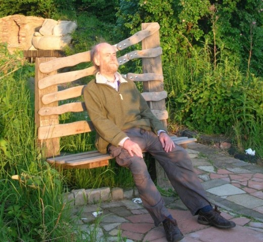 Colin relaxes on the rustic bench, enjoys a leg stretch and contemplated the view.