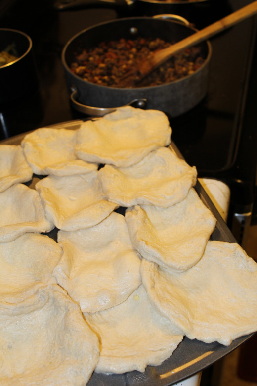 Flattened biscuits laid in placed - ready to be filled.