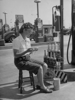 Girl Change Maker Knitting During Slow Moments at the Gilmore Self-Service Gas Station Allan Grant Find  at Allposters.com
