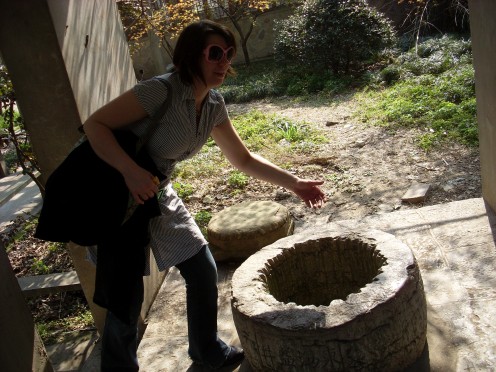 My daughter checking to see if I'd be able to pee into a well from the Ming Dynasty.