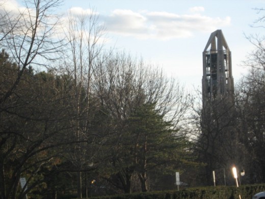 Moser Tower seen from a distance through Naperville's Riverwalk Park