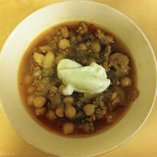 Bowl of Pork and Pepper Soup with Sour Cream Topping