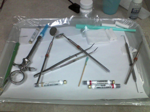 Here we see a Mayo tray with tools and gadgets. Some folks pass out at the sight of a needle. Does this scare you?