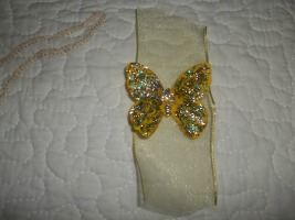 Here is the butterfly with the tail on both ends decorated with the glitter glue. Fold over the tails and secure with floral wire to create a tail.