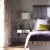 What a beautiful room can be made using primarily lilac, green and gray from this up-and-coming Art Deco-inspired trend.  The use of the channel-back upholstered headboard and polished chrome base of the side table echos the straight and curved lines