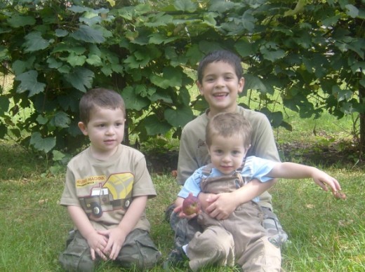 Ryan, Howie holding Alexander in late fall 2009.