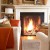 Orange throws on cream colored furniture give a good balance and are a nice touch.