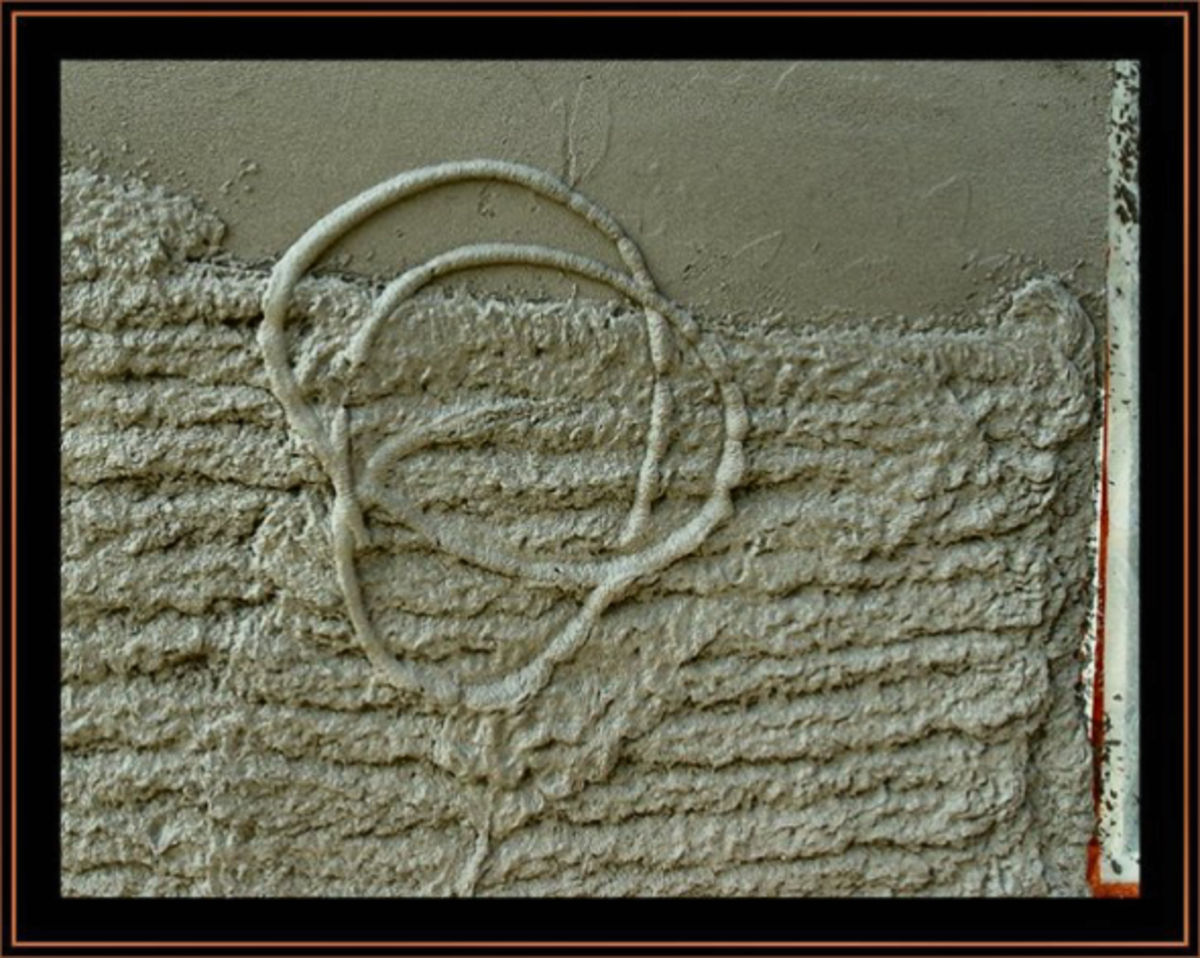Abstract in concrete plaster on the wall of our house