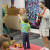 Tami's son participated by holding the microphone. You can see Mac, the yellow and red toy dog, on the floor, taking it easy! Tami's son participated by holding the microphone. You can see Mac, the yellow and red toy dog, on the floor, taking it easy!