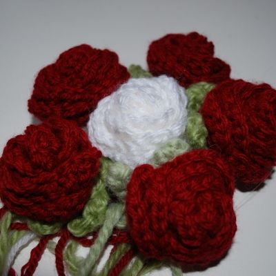 Once attached, pull up and position any green parts that may be hidden under the petals.