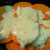 Add some of the dairy mixture, making sure to include some onions.