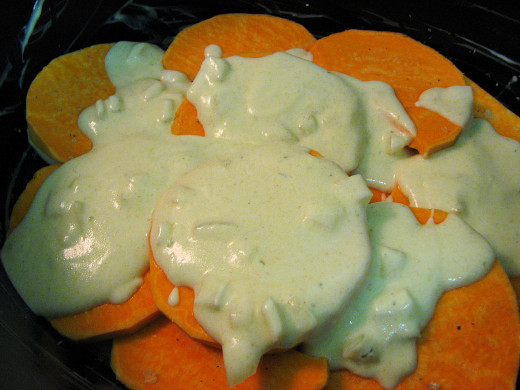 Add some of the dairy mixture, making sure to include some onions.
