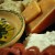 Smoked, aged gouda, goat cheese, olive oil and balsamic vinegar dip and French bread. Smoked, aged gouda, goat cheese, olive oil and balsamic vinegar dip and French bread.