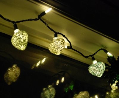 Another view of our luminaries, hung in our living room window.