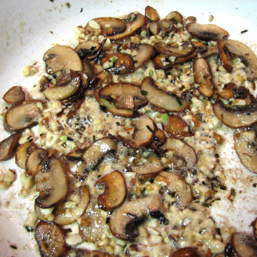 A minute is all that's needed to soften the garlic and nuts.